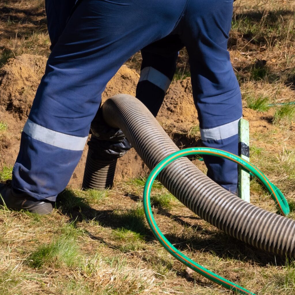 Plumber working with sewer line